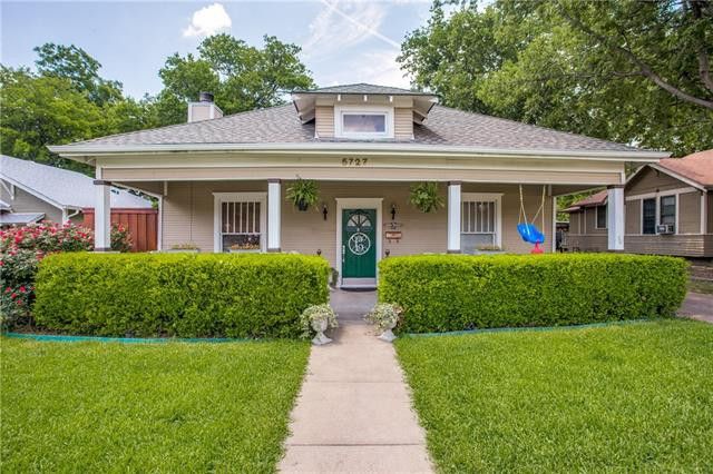Craftsman bungalow with a covered front porch in a Fort Worth neighborhood
